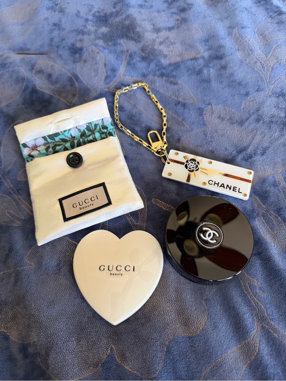 CHANEL Black Round Compact with Gold-Trim Tag and Chain